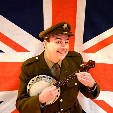 Man dressed in 1940s uniform playing a Ukelele